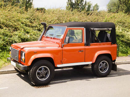This Td5 Defender 90 comes with features such as:
black mohair hood, Safety Devices roll cage, Puma rear seats and painted in metallic orange.

 We have built many of these Defender 90 Soft Tops and   they continue to   be a very popular build.
 Real Defender Fun for the summer, every garage should have one !!